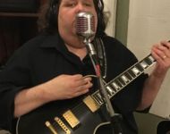 Joey singing into Elvis mic at Sun Studio